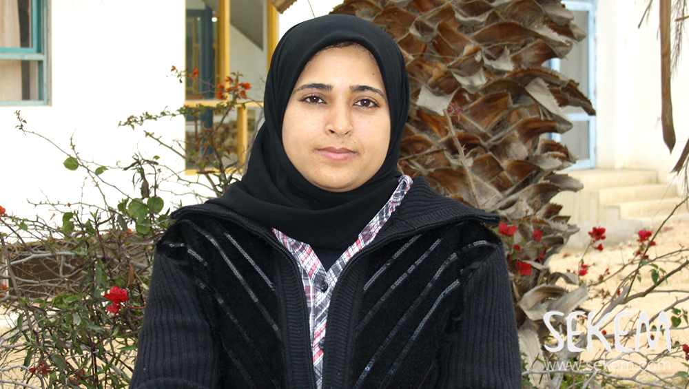 Noura Nasser takes care of children with handicaps in SEKEMs School dedicated to them.